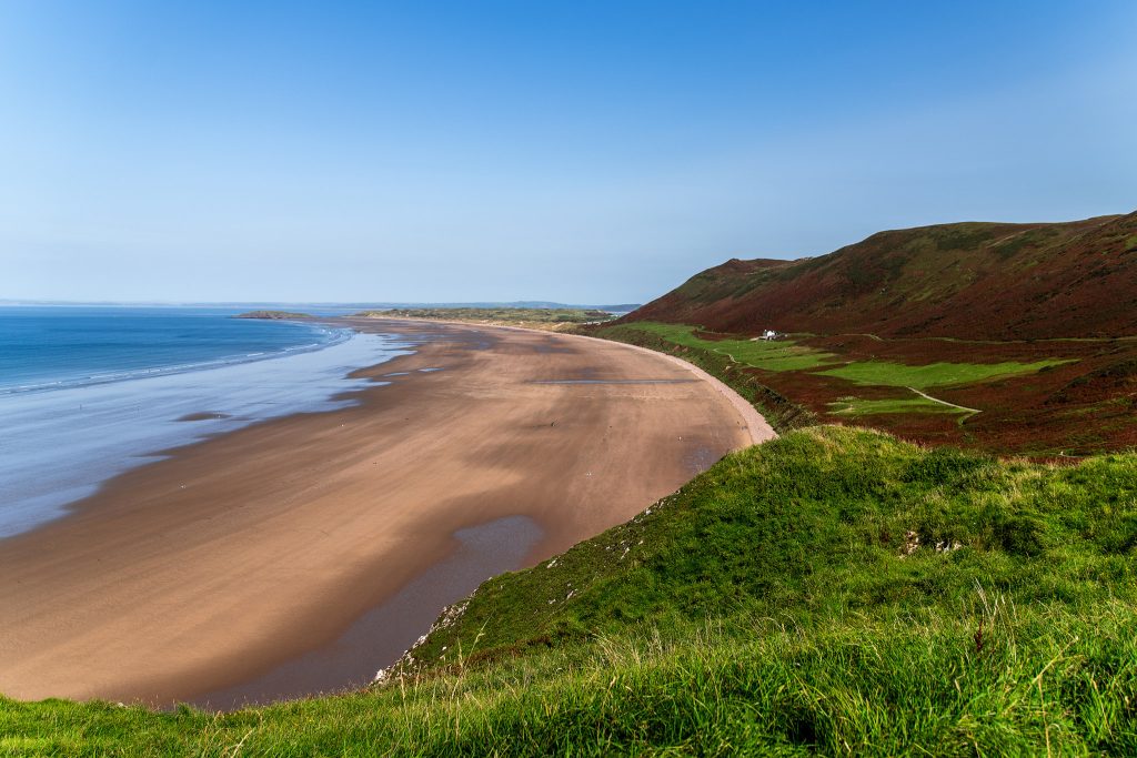 A view along the sandy beach at Rhossili beach, Gower