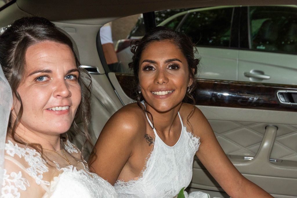 cat & kirsty pose in the back of the limo before leaving for honeymoon
