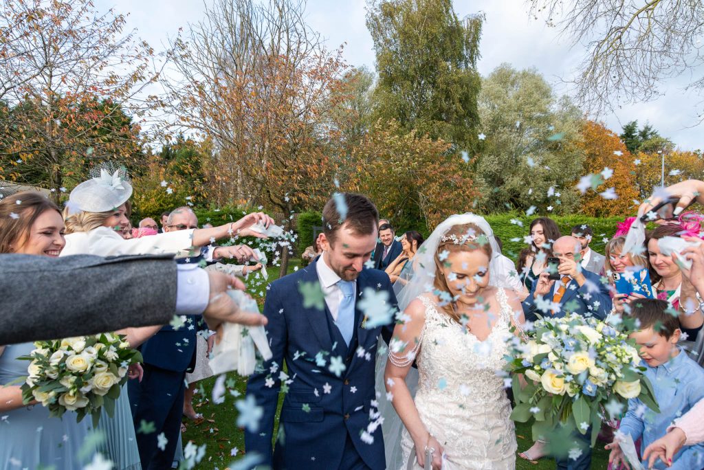 amy and ryan are showered in confetti