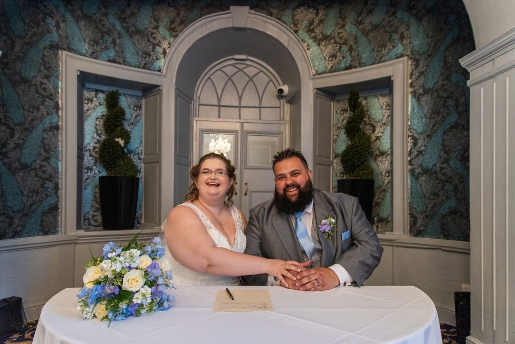 jane & jamie sign the register after their wedding